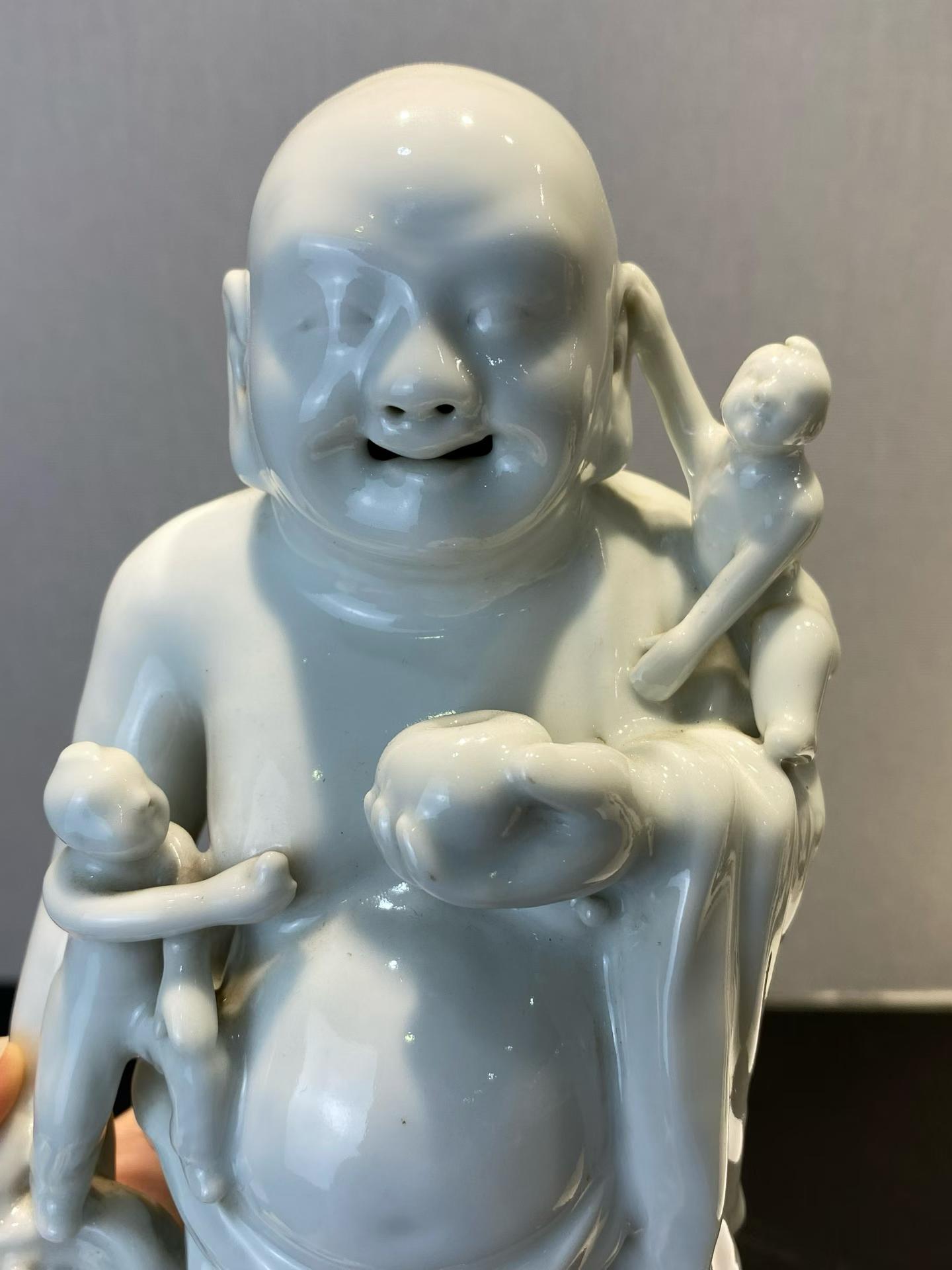 白釉五子戏弥勒塑像